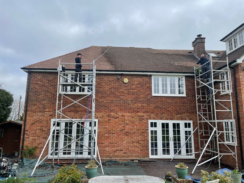 Roof cleaning carried out safely from scaffold towers by The Roof Moss Cleaners in Earley